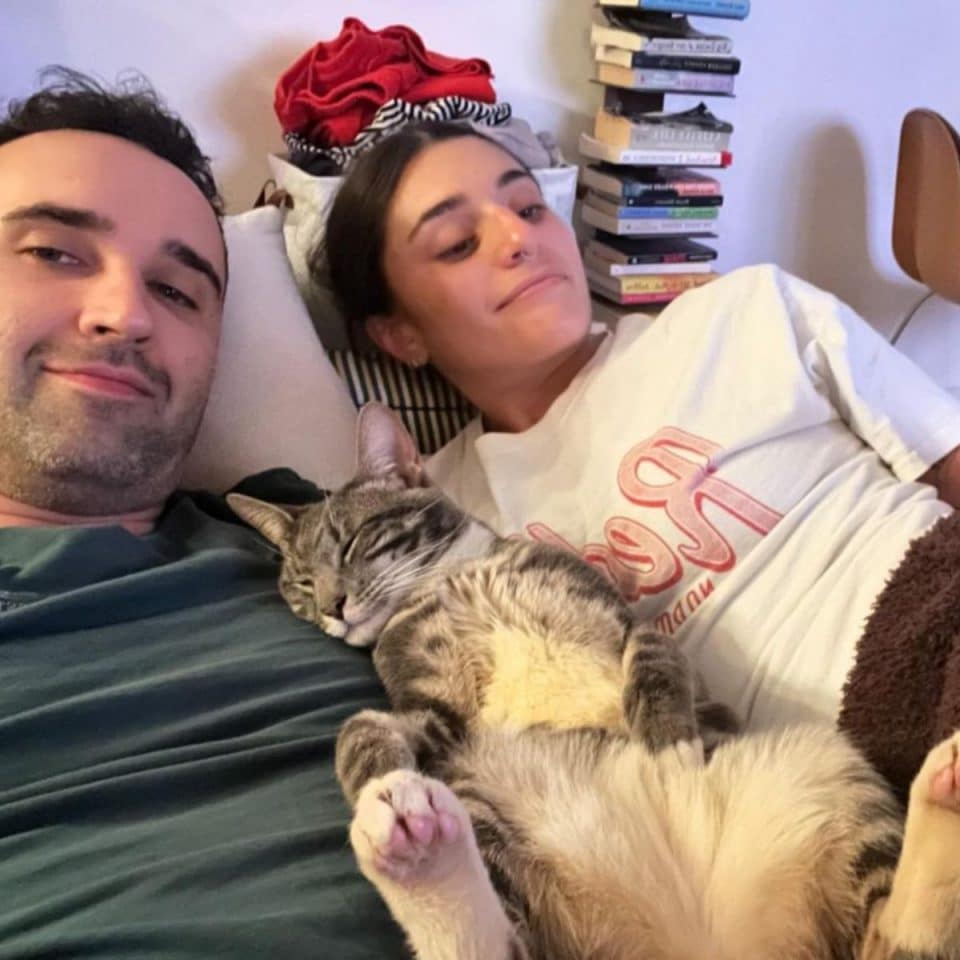 couple and cat in a bed 960x960